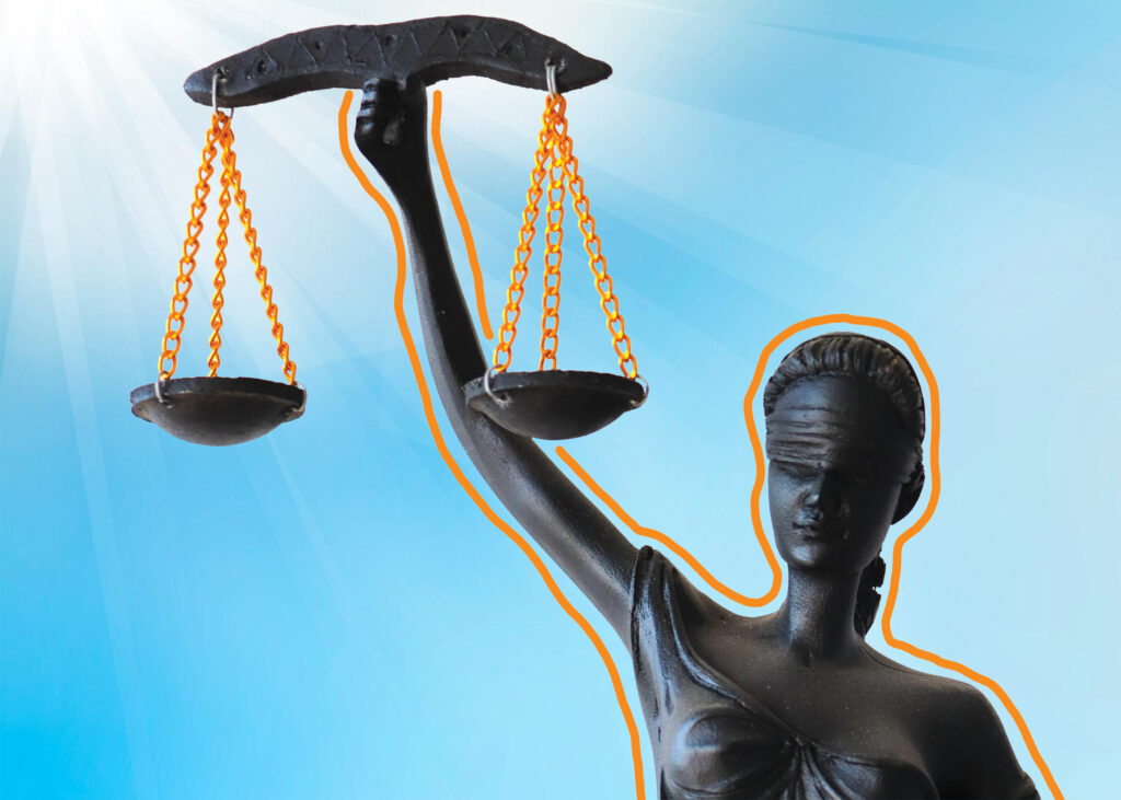 Woman holding the scales of justice for GAL 