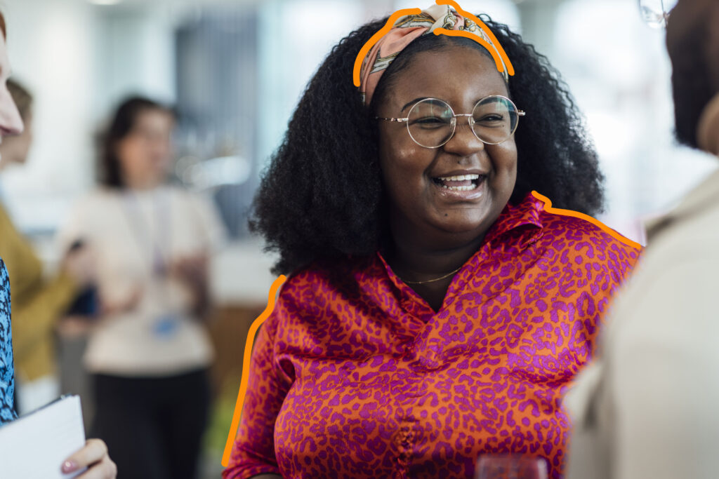 Woman talking to someone and smiling. Project management